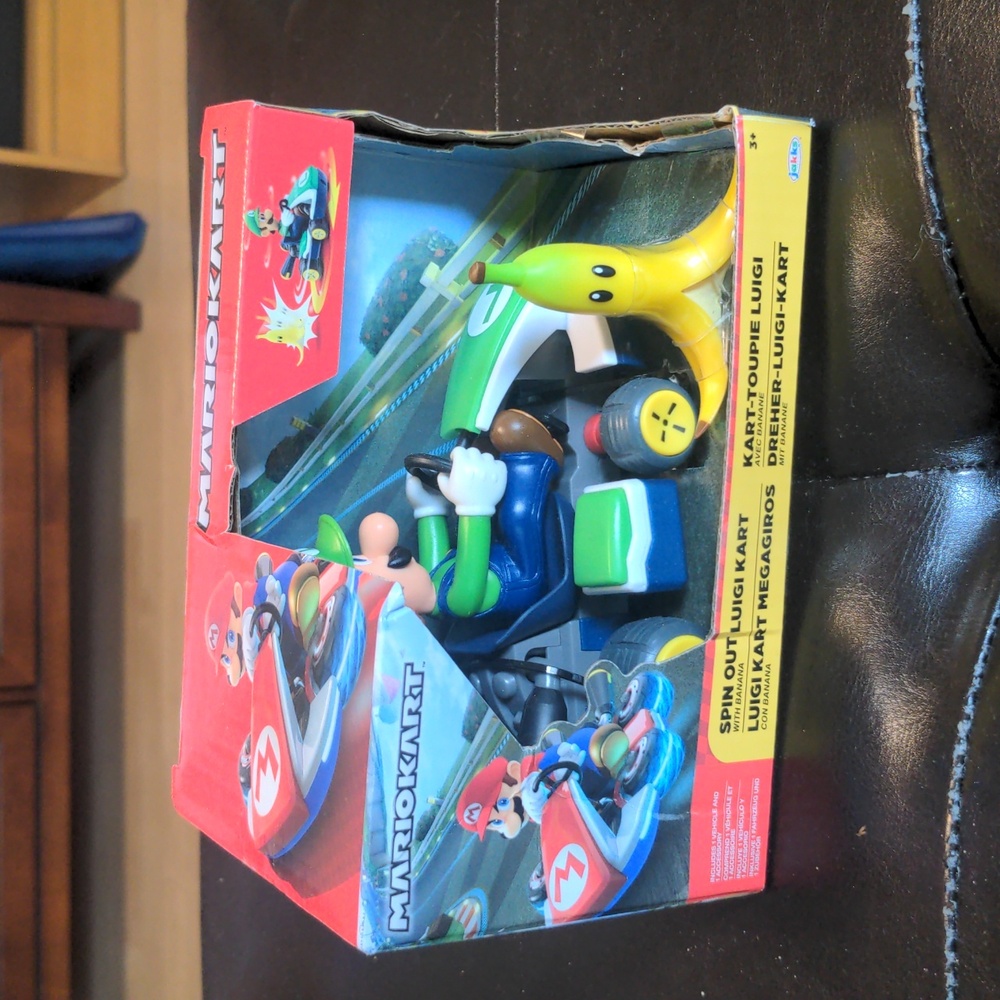 Mario kart spin out Luigi kart with banana, new without tags
